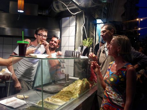 Good Natured Force Feeding at the Falafel Shack - Yehuda Is 2nd From The Left